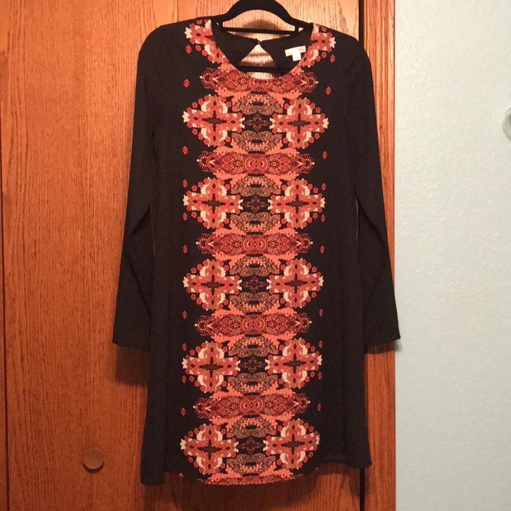Black long sleeve dress with a red pattern.